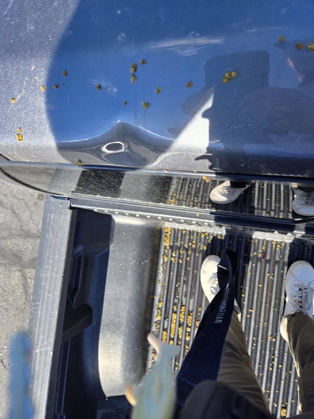 Hail dent on truck tailgate rail before paintless dent repair